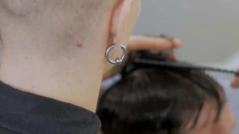Hairstylist  at work Stock Footage 104876923