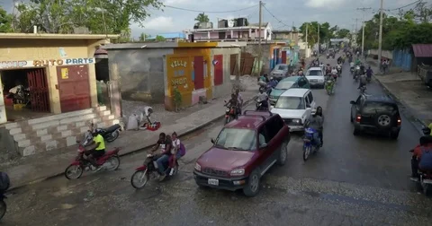Haiti cars taxis motorcycles, drone Stock Footage