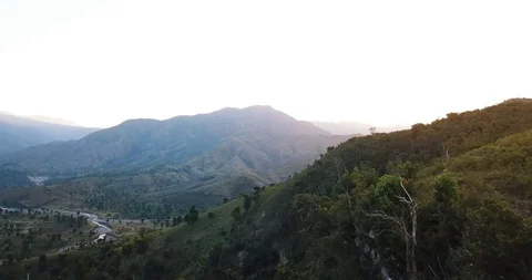 Haiti Mountains Sunrise Passing Trees Aerial Drone Stock Footage