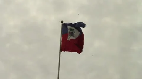 Haitian flag flies in cloudy sky Stock Footage 16789776