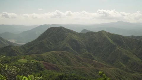 Haiti's rolling hills and valleys stretch into the horizon in a gentle wind. Stock Footage 299904394