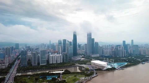 Haixinsha sail structures below a cloud veiled skyline in Guangzhou China Stock Footage 346449399