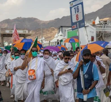 Hajj pilgrims walking, Day time, Performing Hajj, Mina, Makkah, Saudi Arabia, Stock Photos