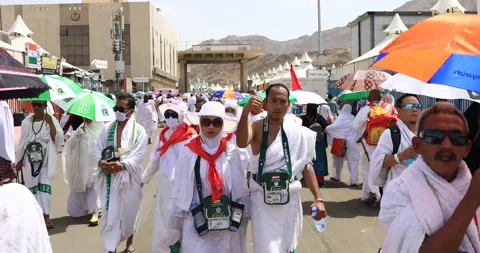 Hajj Pilgrims Walking down the road in Mina, Makkah, Saudi Arabia, August 201 Stock Footage 136037020