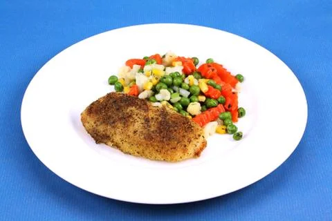 Hake and vegetables Stock Photos