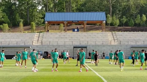 Hakimi attends Morocco training on bicycle amid tight security measures, BASKING Stock Footage 337551709