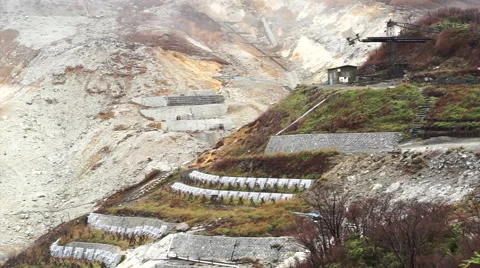 Hakone Owakudani active volcano valley. View from top seeing mine and steaming Stock Footage 69066110