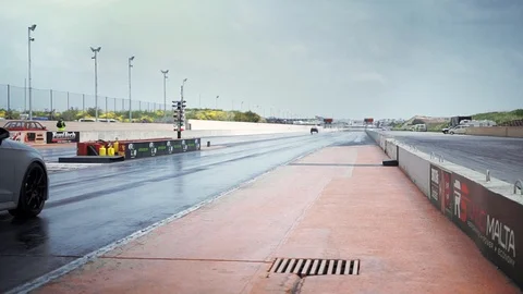 Hal Far, Malta - April 20, 2019; An old and powerful drag race monster car makin Stock Footage 108853903