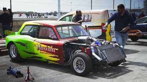 Hal Far, Malta - April 20, 2019; Servicemen preparing an old and powerful drag r Stock Footage 108853933