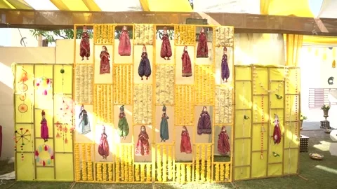 Haldi Decor with Yellow Flowers and Puppet Stock Footage 247262258