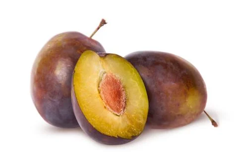 Half and two violet plums Stock Photos