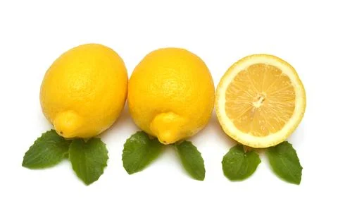 Half and whole lemon fruit tropical with leaves isolated on white backgroun.. Stock Photos