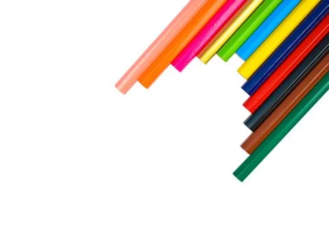 Half arrow shape made with some different colored wood pencil crayons on a wh Stock Photos