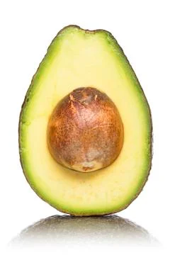 Half of an avocado with kernel and reflection, isolated on white Foto stock