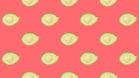 A half of Avocado in seamless loop pattern on a coral background. Exotic fruits Stock Footage 222319113
