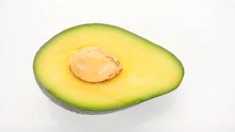 Half  of avocado turn on white background Stock-Footage 228927460