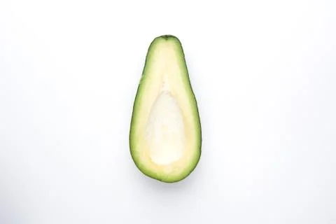 Half Avocado on a white background top view. Stock-Fotos
