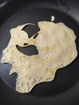 This is a half-baked funny pancake flatbread food Stock Photos