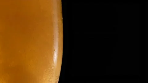 Half a beer glass with bubble. Refreshing and cold beer in a beer glass Stock Footage 156171666
