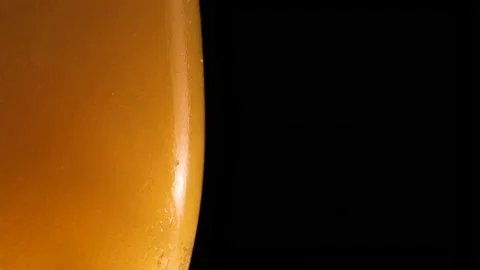 Half a beer glass with bubble. Refreshing and cold beer in a beer glass Stock Footage 164436724
