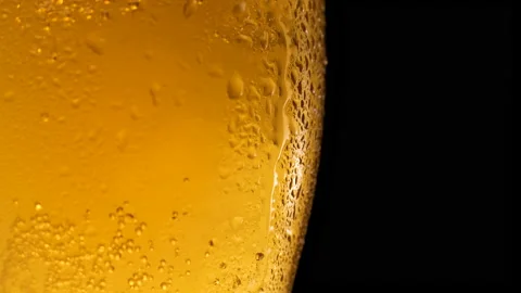 Half a beer glass with falling water drops Video stock 162107070