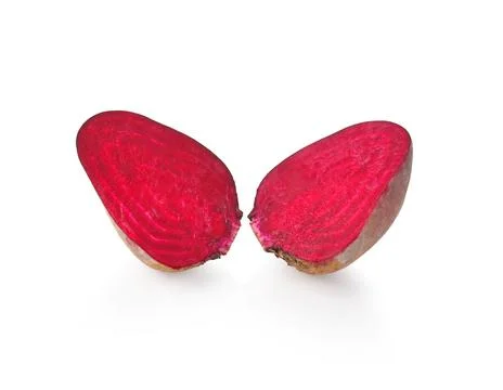Half of beetroot vegetable on white background. Stock Photos