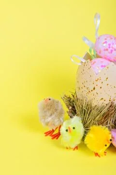 Half of big easter egg and small chickens 写真素材