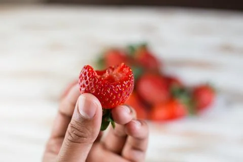 Half Bitten Strawberry Stockfoto's