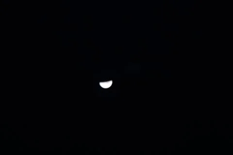 Half black moon in the sky Stock Photos