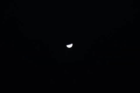 Half black moon in the sky Stock Photos