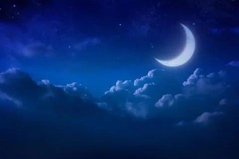 Half blue moon behind cloudy on sky and star at night. Outdoors at night. lun Photos