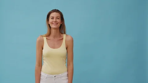 Half Body Shot of Beautiful Model in Yellow Top Smiling Stock Footage 116728692