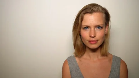 Half Body Shot of Blonde Model Winking at Camera Video stock 115508790