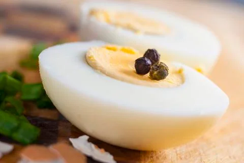 Half of boiled egg  prepared on cutting board Stock Photos