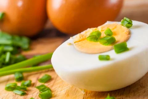Half of boiled egg  prepared on cutting board 스톡 사진