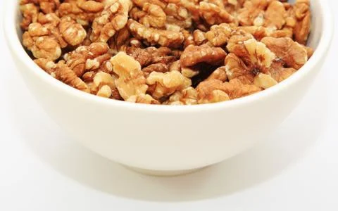 Half a bowl of walnuts Stock Photos