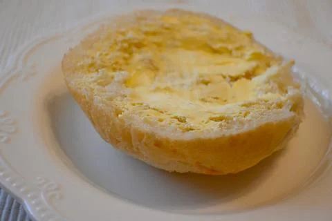 Half bread roll with margarine Fotos de archivo