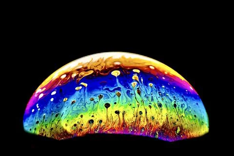 Half bubble with abstract patterns on a dark background Stock Photos