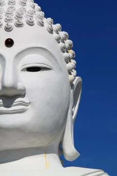 Half of a buddha's face in a dramatic sky background Foto stock