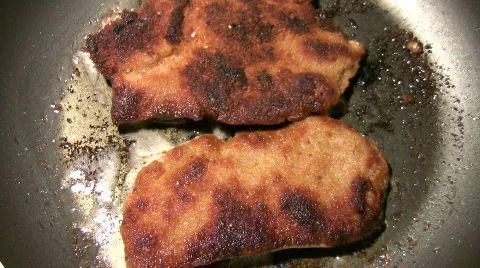 Half burned escalopes Stock Footage 307090