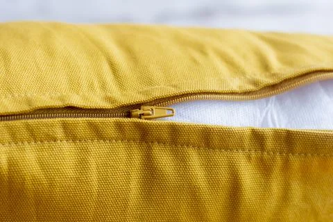 A half-buttoned lock on the pillowcase worn on the pillow. Stock Photos