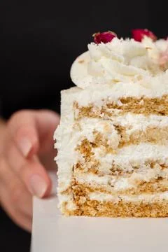 Half a cake. Close-up of a cut cake with visible layers and filling. onditer Stock Photos