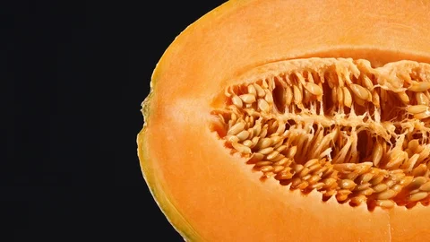 Half cantaloupe melon isolated on the black background Stock-Footage 113675449