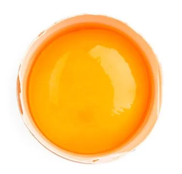 Half chicken egg with yolk close up on a white. The form of the top. Stock Photos