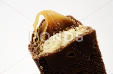 Half a chocolate bar with caramel Stock Photos