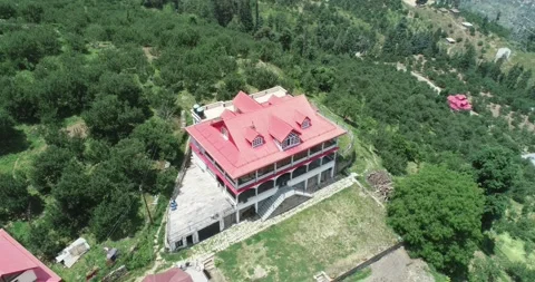 Half Circle Drone Shot Of beautiful house on green mountain Stock Footage 136373728