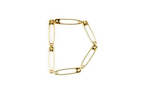 Half circle shape made of safety pins  on a white background Foto stock