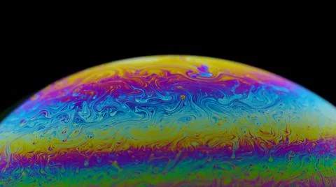 Half circle a soap bubble surface multicolored in motion isolated on black Stock Photos