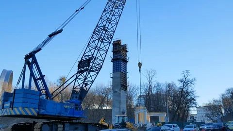 Half closed road while heavy machinery industrial crane building bridge support Stockbeeldmateriaal 105379729