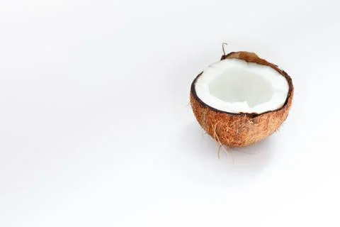 Half of coconut closeup on a white background Stock Photos